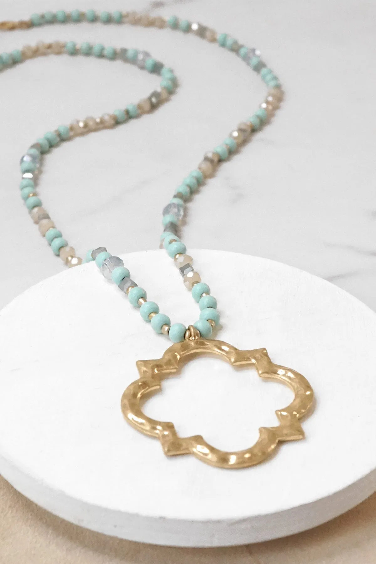 Long Wooden Bead Necklace with Clover Quatrefoil gold pendant - Light turquoise